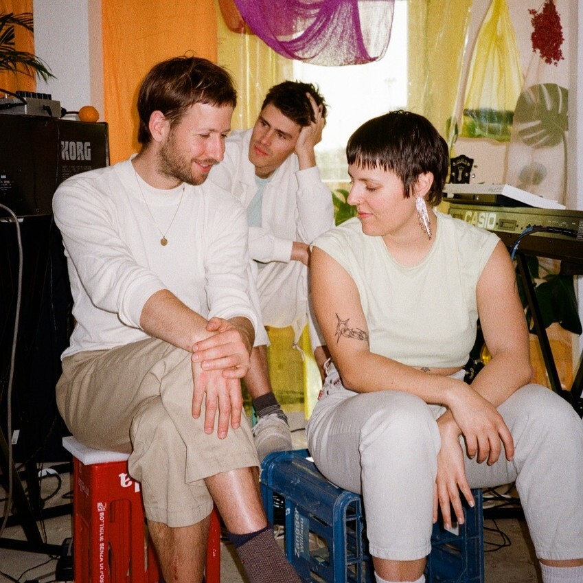 band sitting smiling